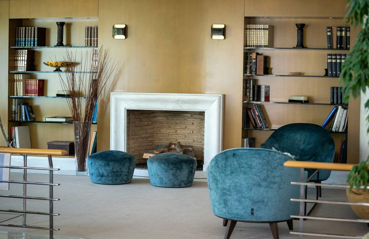 home depot wall sconces lighting fixtures paired with recessed ceiling lights in a living room
